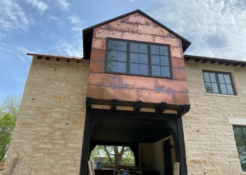 Copper metal panel facade on a stone building for Skylight Installation in Mount Holly